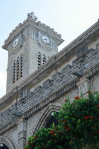 clock tower of historic stone church building